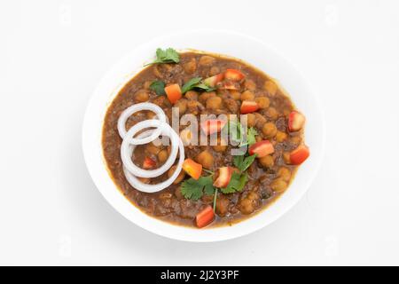 Punjabi Chhole également connu sous le nom de Chhola Masala Sabji Amritsari Chole Sabzi Masaledar Chana Chola ou pois chiches le curry à légumes est fait de pois chiches oignon Tomato Banque D'Images