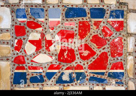 Drapeau national de la Corée du Nord sur fond de mur de pierre. Drapeau sur fond de texture de pierre. Banque D'Images