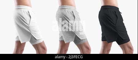 Modèle de short blanc, noir, chiné avec sous-pantalon de compression, poches latérales, sur un homme sportif, pour le design, le motif. Définir isolé sur le backgr Banque D'Images