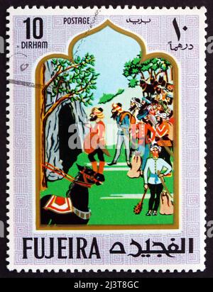 FUJEIRA - VERS 1967: Un timbre imprimé dans la Fujeira montre scène de la Fairy Tale Ali Baba et les quarante Thieves, vers 1967 Banque D'Images