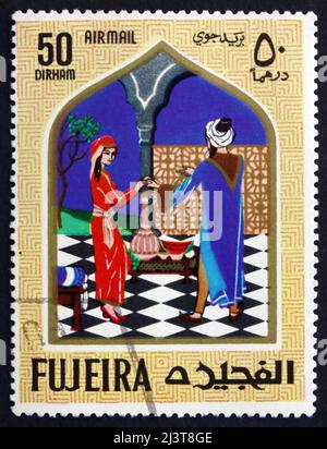 FUJEIRA - VERS 1967: Un timbre imprimé dans la Fujeira montre scène de la Fairy Tale Aladdin et la lampe magique, vers 1967 Banque D'Images