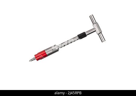 Tournevis avec mécanisme réversible et support magnétique de buses remplaçables. Un jeu de buses. Outils pour l'atelier de construction et de réparation. Isoler activé Banque D'Images