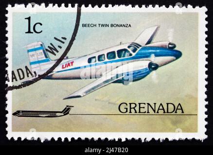 GRENADE - VERS 1976: Un timbre imprimé à la Grenade montre Beech Twin Bonanza, avion, vers 1976 Banque D'Images