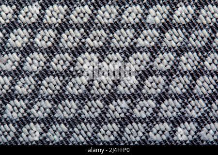 Texture tricotée. Texture de tissu jacquard avec motif géométrique gris. Motif mosaïque en crochet Banque D'Images