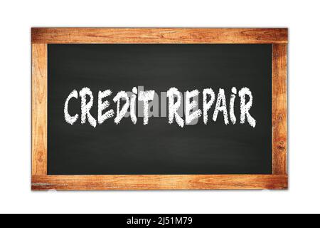 LE texte DE RÉPARATION DE CRÉDIT est écrit sur le tableau noir de l'école de cadre en bois. Banque D'Images