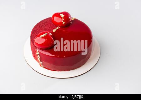 Miroir rouge à moitié vitrifié et entrées en velours avec mini coeurs et or Banque D'Images