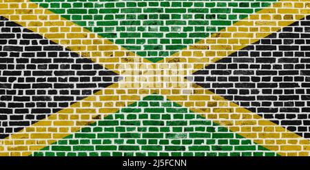 Gros plan sur un mur de briques avec le drapeau de la Jamaïque peint dessus. Banque D'Images