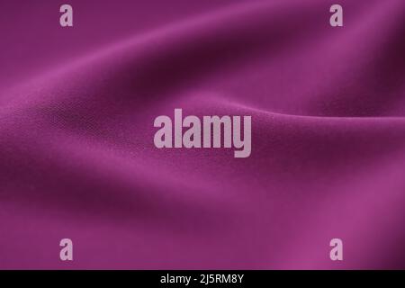 Fond de texture en tissu violet irisé. Tissu drapé luxueux Banque D'Images