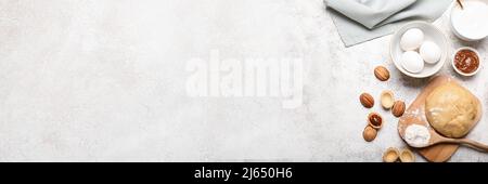 Ingrédients pour la préparation de biscuits en forme de noyer sur fond de grunge avec espace pour le texte Banque D'Images