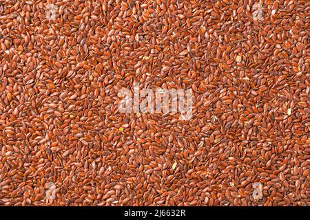 Beaucoup de graines de lin, fond culinaire. Source d'oméga 3, alimentation saine. Vue horizontale. Banque D'Images