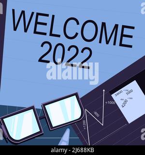 Présentation conceptuelle Bienvenue 2022. Mot pour la célébration du nouvel an motivation pour commencer les Cheers Félicitations papier assis sur le bureau composé de tableaux Banque D'Images