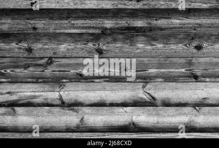 Mur en bois noir en rondins rugueux, texture photo d'arrière-plan Banque D'Images