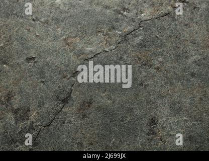 Surface rocailleuse rugueuse avec tons gris Banque D'Images