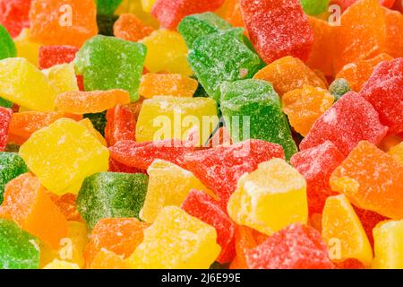 fruits confits multicolores dans un cadre circulaire. dessert sucré. Photo de haute qualité Banque D'Images