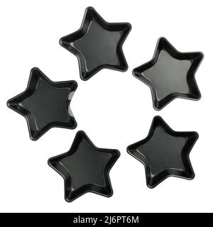 Moules de cuisson en forme d'étoile métalliques isolés sur fond blanc Banque D'Images