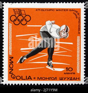 MONGOLIE - VERS 1967 : un timbre imprimé en Mongolie montre le patinage de vitesse, Jeux Olympiques d'hiver 10th, Grenoble, France, vers 1967 Banque D'Images