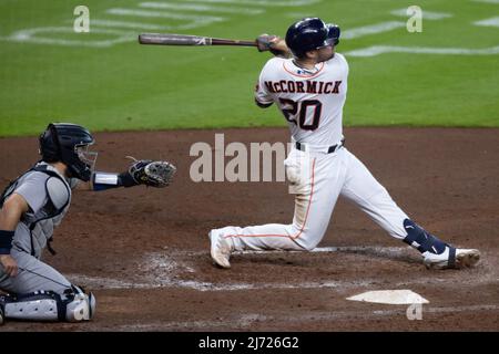 Houston Astros Center Fielder Chas McCormick (20) atteint le troisième repas contre les Seattle Mariners, mercredi 4 mai 2022, à Houston, Texas. TH Banque D'Images