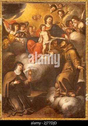 MATERA, ITALIE - 7 MARS 2022 : la peinture baroque de Madonna avec le Saint François d'Assise et le Saint Clare dans l'église Chiesa di Santa Chiara Banque D'Images