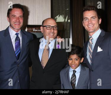 LOS ANGELES - APR 7 : Tim DeKay, Willie Garson, Nauen Garson, Matt Bomer au dîner annuel 22st de l'Alliance for Children's Rights à l'hôtel Beverly Hilton le 7 avril 2014 à Beverly Hills, CA Banque D'Images