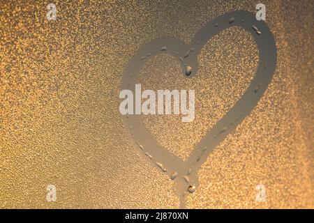 L'inscription sur le coeur en verre sueur Banque D'Images