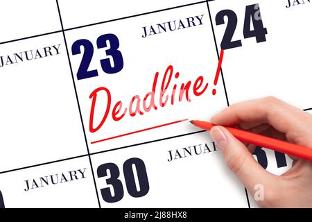 23rd jour de janvier. Dessiner à la main une ligne rouge et écrire le texte Date limite le 23 janvier. Mot d'échéance inscrit au calendrier mois d'hiver, Banque D'Images