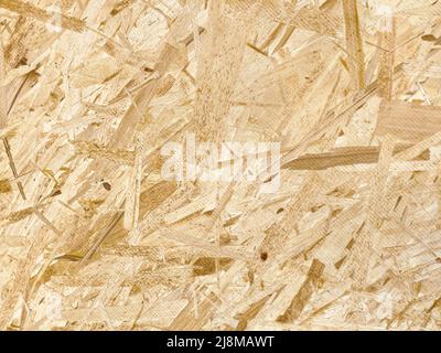 Texture OSB du matériau - plaque de copeaux de bois comprimé recyclé, texture de contreplaqué, gros plan Banque D'Images