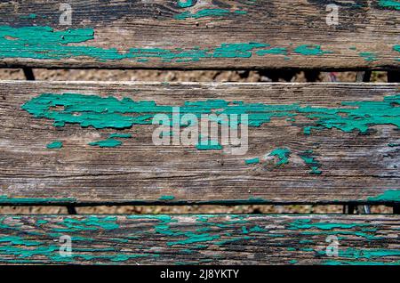 Bois peint en vert très abîmé comme arrière-plan ou texture Banque D'Images