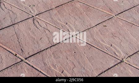 Plancher en béton estampé, revêtement extérieur, motif carré rouge Banque D'Images