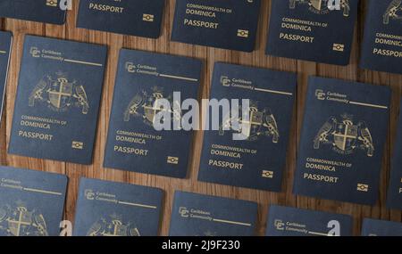 Passeports de l'état des Caraïbes de la Nouvelle Dominique , vue de dessus, sur une table en bois Banque D'Images
