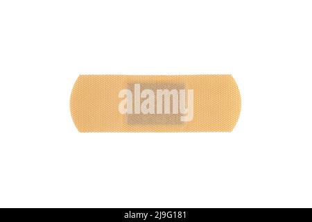 Bandage adhésif beige ou plâtre adhésif médical pour premiers soins isolé sur fond blanc. Banque D'Images