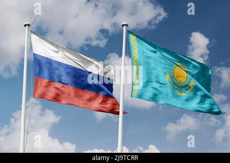 Russie et Kazakhstan deux drapeaux sur les mâts de drapeaux et fond bleu ciel nuageux Banque D'Images