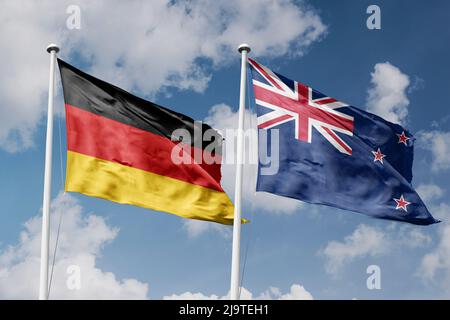 Allemagne et Nouvelle-Zélande deux drapeaux sur les mâts et fond bleu ciel nuageux Banque D'Images