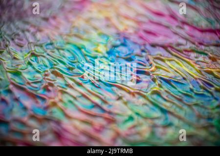 Texture créée avec de l'acrylique de différentes couleurs formant des lignes courbes dans diverses directions, idéale pour les arrière-plans et les textures et pour la conception graphique Banque D'Images