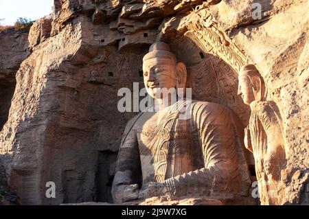 La statue de Bouddha à Yungang Grottes, son ancien temple bouddhiste grottes près de la ville de Datong dans la province chinoise de Shanxi Banque D'Images