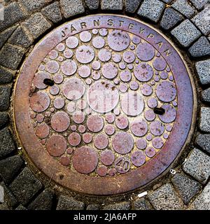 Couverture de trou d'homme à Reykjavik, Islande Banque D'Images