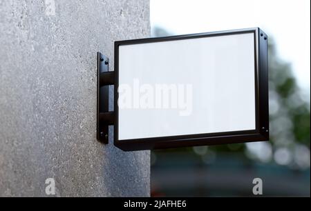 Affiche murale vierge en forme de maquette accrochée à la façade d'un magasin. Modèle d'affichage commercial rectangulaire pour l'extérieur, pour une image de marque dans un rendu réaliste 3D Banque D'Images