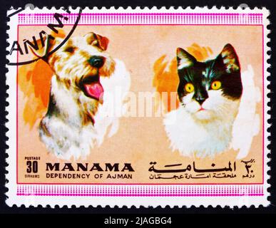 MANAMA - VERS 1972: Un timbre imprimé dans le Manama montre chien et chat, animaux, vers 1972 Banque D'Images