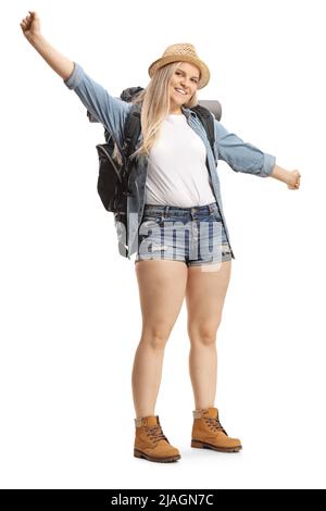 Portrait complet d'une jeune femme routard souriant et gestante avec les mains isolées sur fond blanc Banque D'Images