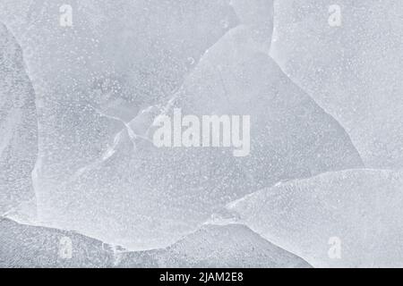 Surface fissurée par la glace très près. Texture et arrière-plan de la macro ICE Banque D'Images