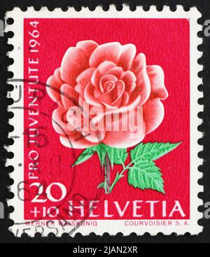 SUISSE - VERS 1964 : un timbre imprimé en Suisse montre Rose, Rosa, Floraison, vers 1964 Banque D'Images