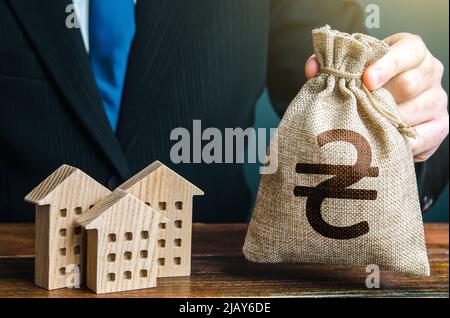 Aide financière à l'Ukraine pour la restauration et la construction de nouveaux logements. Investissements dans l'immobilier et l'industrie de la construction. Offre bancaire de Mo Banque D'Images