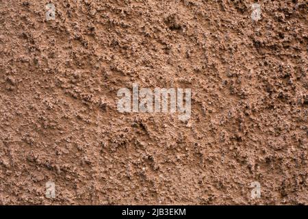 mur en béton pastel à l'extérieur. Image d'arrière-plan.échantillon de surface en béton vieilli avec plâtre en terre cuite. Papier peint image texturée. Vue du dessus Banque D'Images