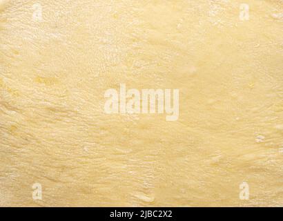 Texture de la pâte roulée uniformément. Fond de la pâte pour la cuisson. Photo de haute qualité Banque D'Images