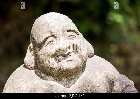 Jizo (Burai / Hotei) par un sculpteur inconnu dans la rue, Nagoya, Japon. Au Japon, il y a beaucoup de vieilles statues de Jizo qui ont été faites il y a longtemps. Banque D'Images