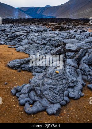 Motifs abstraits dans la lave pahoehoe du volcan Fagladadalsfjall, Islande Banque D'Images