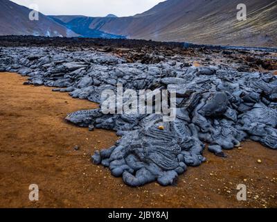 Motifs abstraits dans la lave pahoehoe du volcan Fagladadalsfjall, Islande Banque D'Images