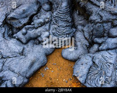 Motifs abstraits dans la lave pahoehoe du volcan Fagladadalsfjall, Islande Banque D'Images