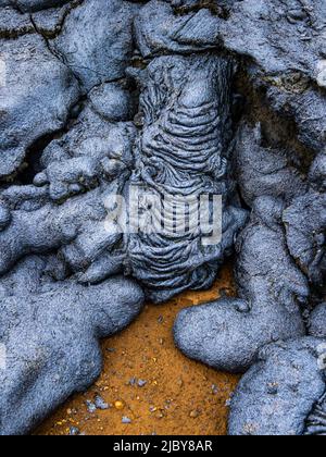 Motifs abstraits dans la lave pahoehoe du volcan Fagladadalsfjall, Islande Banque D'Images