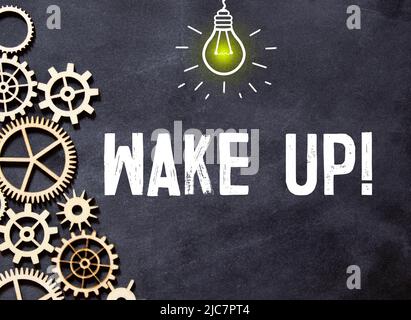 Réveil de texte sur fond noir, concept de motivation. Banque D'Images