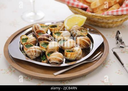 escargots, escargots avec persil et beurre à l'ail Banque D'Images